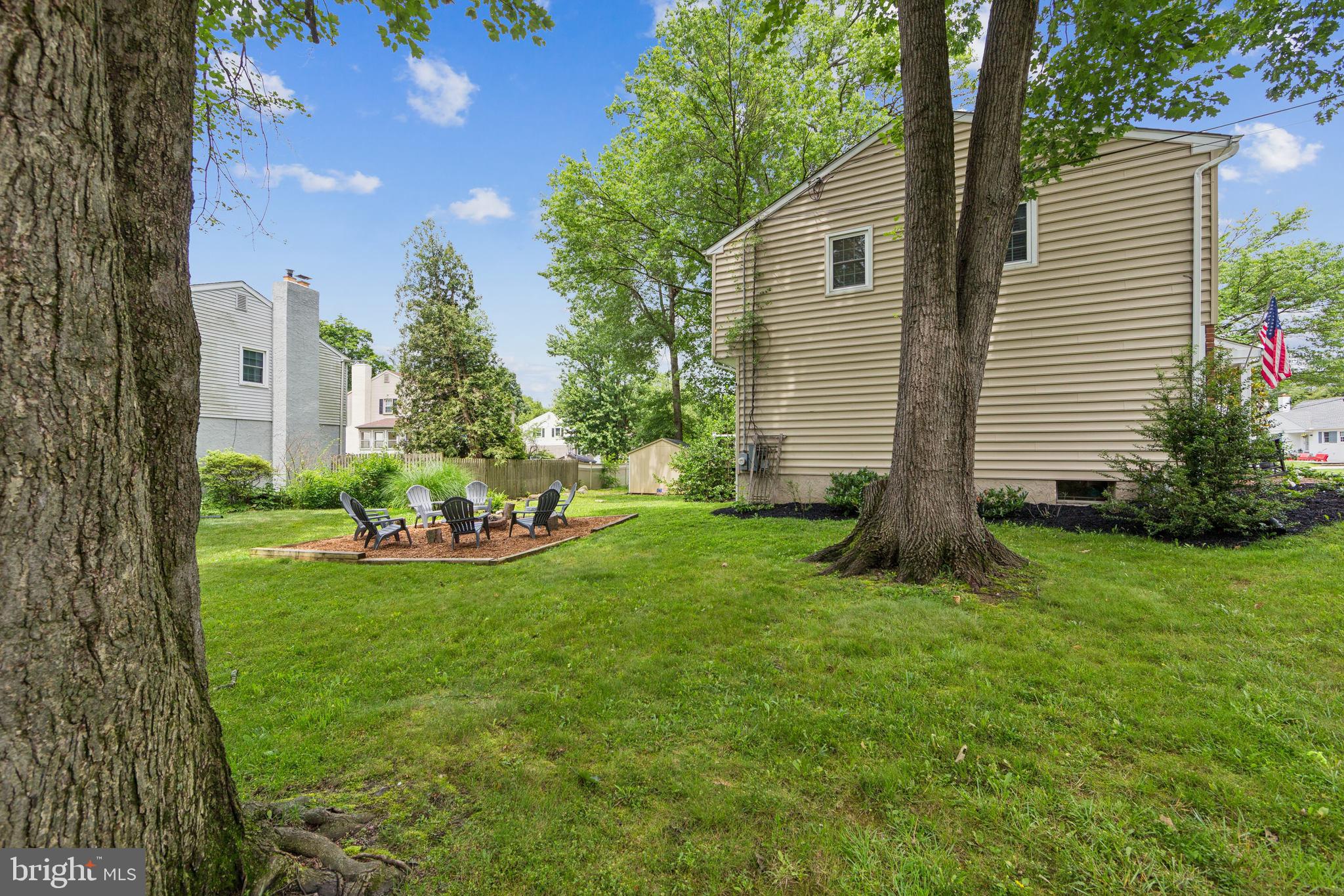 15 Oakford Road Wayne, PA 19087 - Photo 44 of 54 a view of a backyard with sitting area and garden
