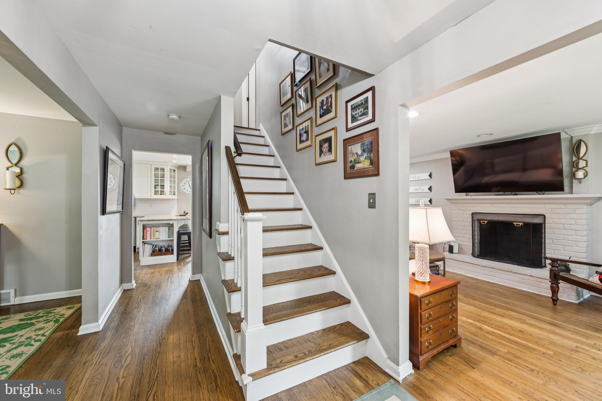 15 Oakford Road Wayne, PA 19087 - Photo 5 of 54 a view of a livingroom with wooden floor and a flat screen tv