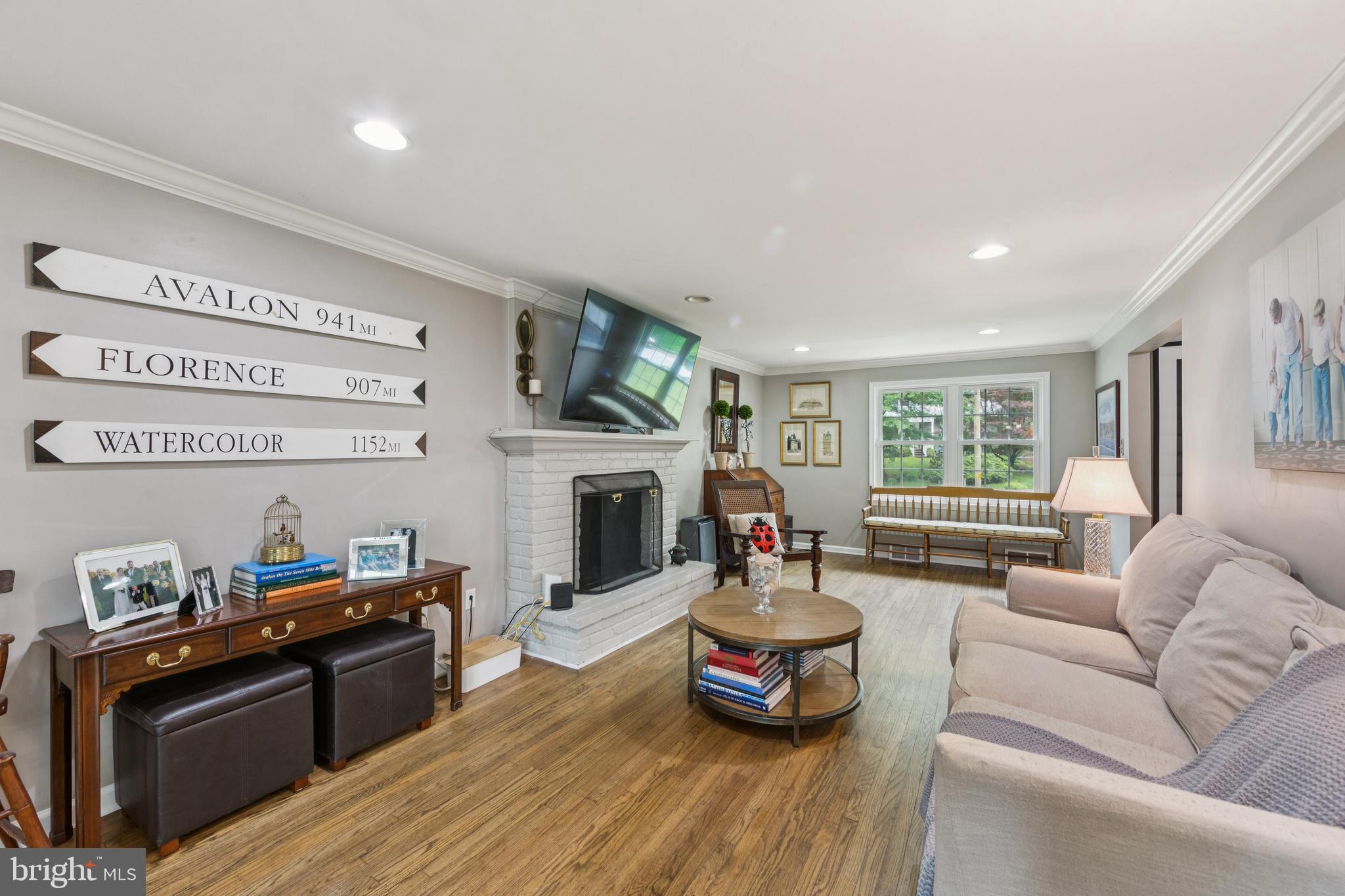 15 Oakford Road Wayne, PA 19087 - Photo 8 of 54 a living room with furniture fireplace and flat screen tv