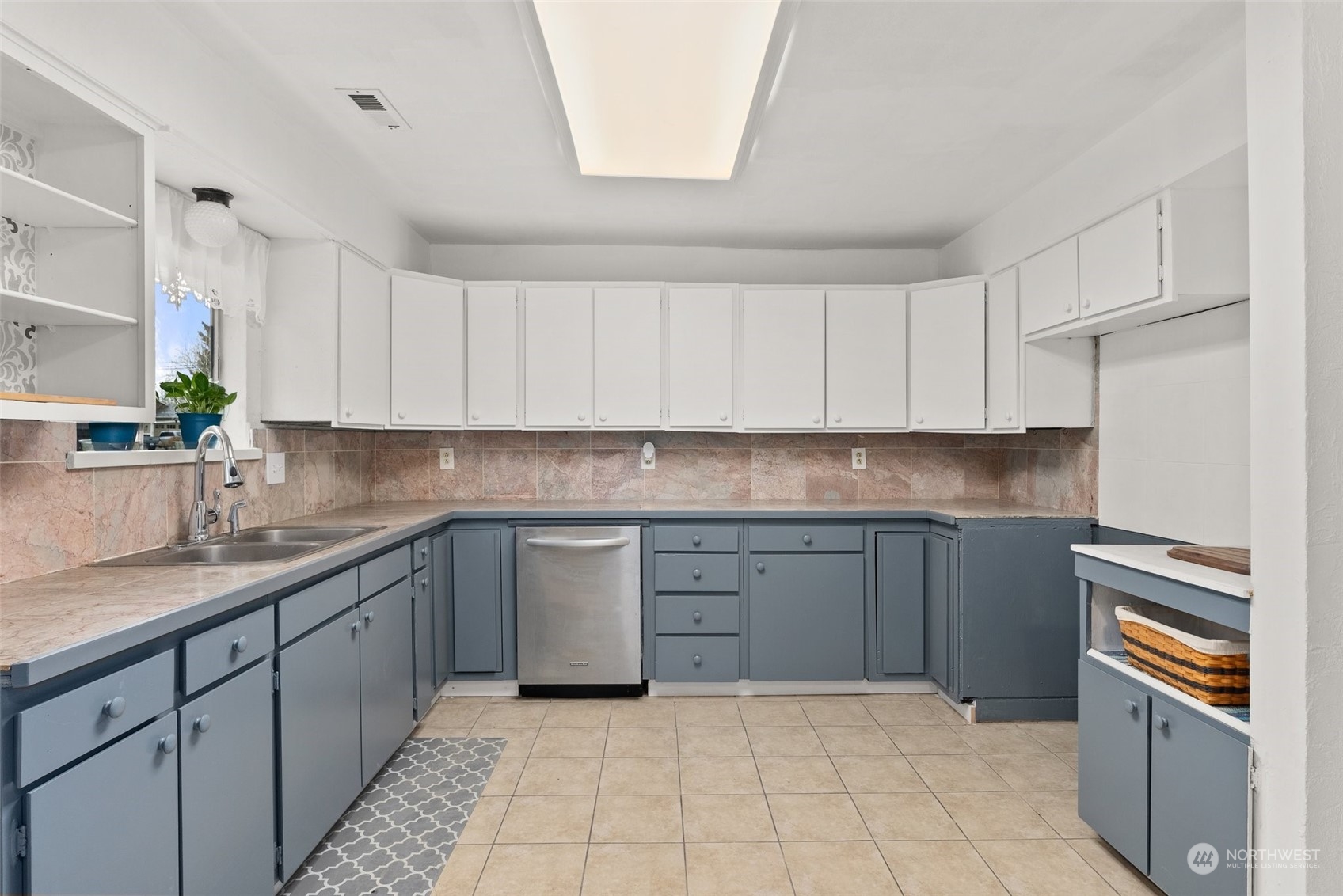 1212 Long Road Centralia, WA 98531 - Photo 12 of 40 a kitchen with granite countertop white cabinets and appliances