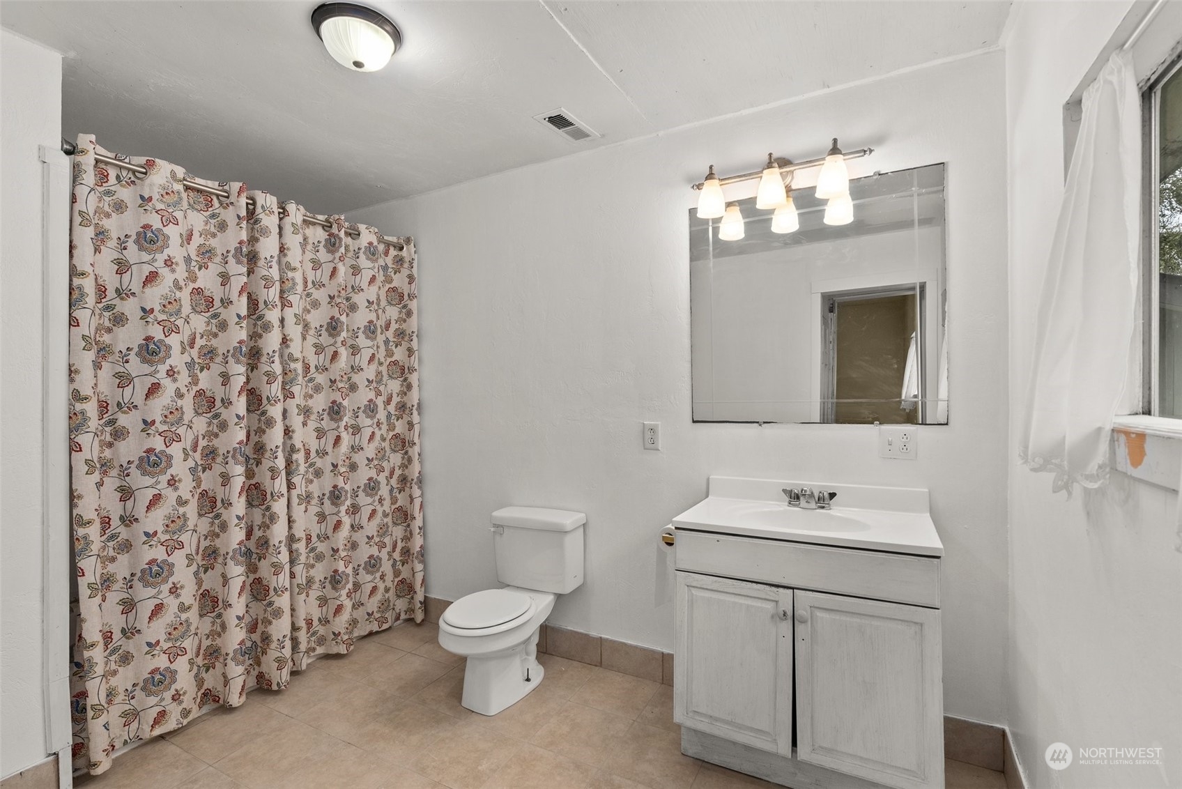 1212 Long Road Centralia, WA 98531 - Photo 20 of 40 a white toilet sitting next to a bathroom sink
