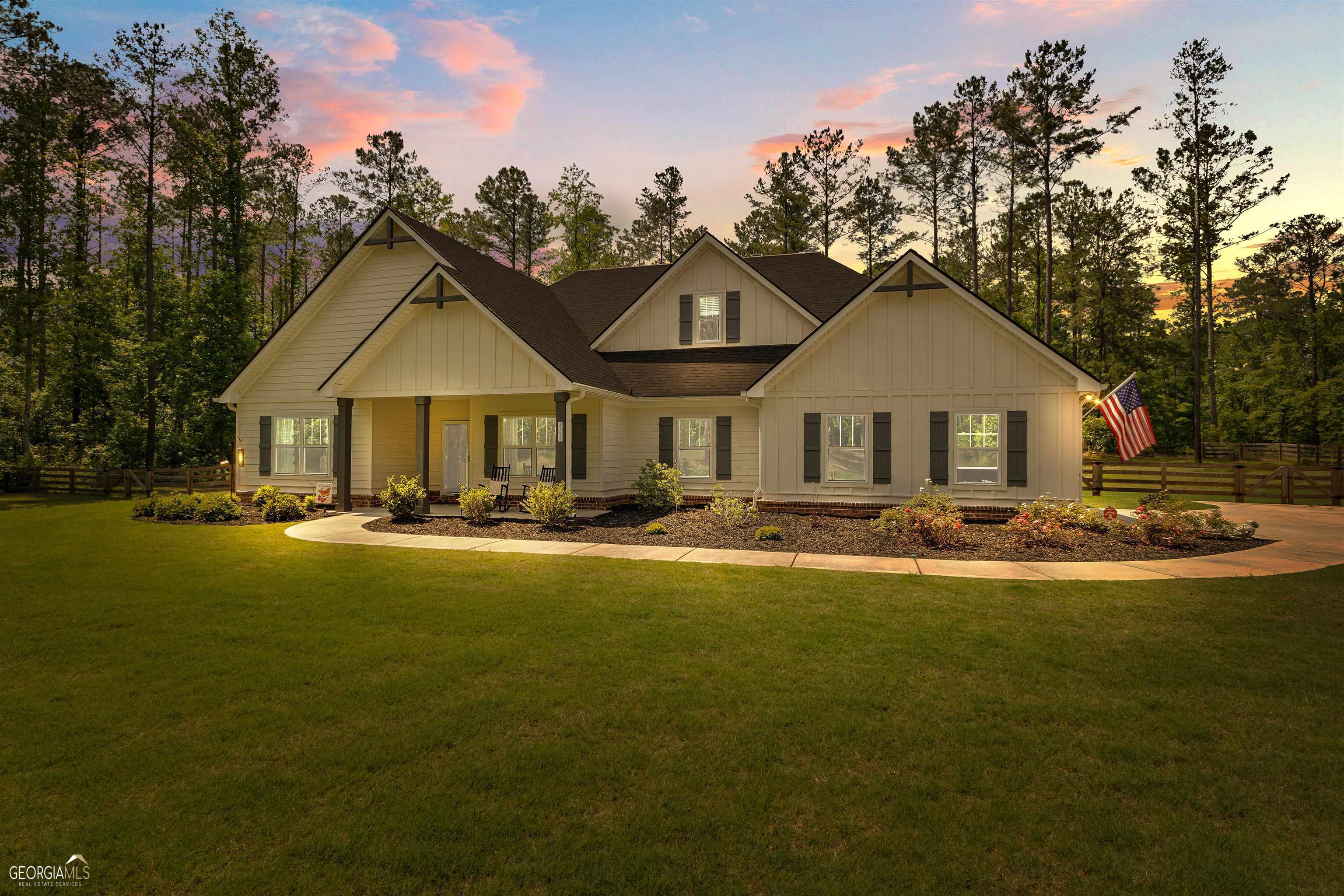 a front view of a house with yard patio and fire pit