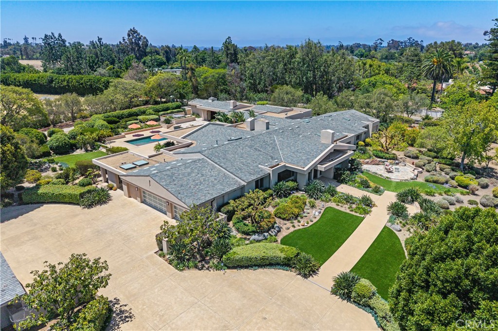 6533 Lago Lindo Rancho Santa Fe, CA 92067 - Photo 2 of 57 an aerial view of a house with a garden