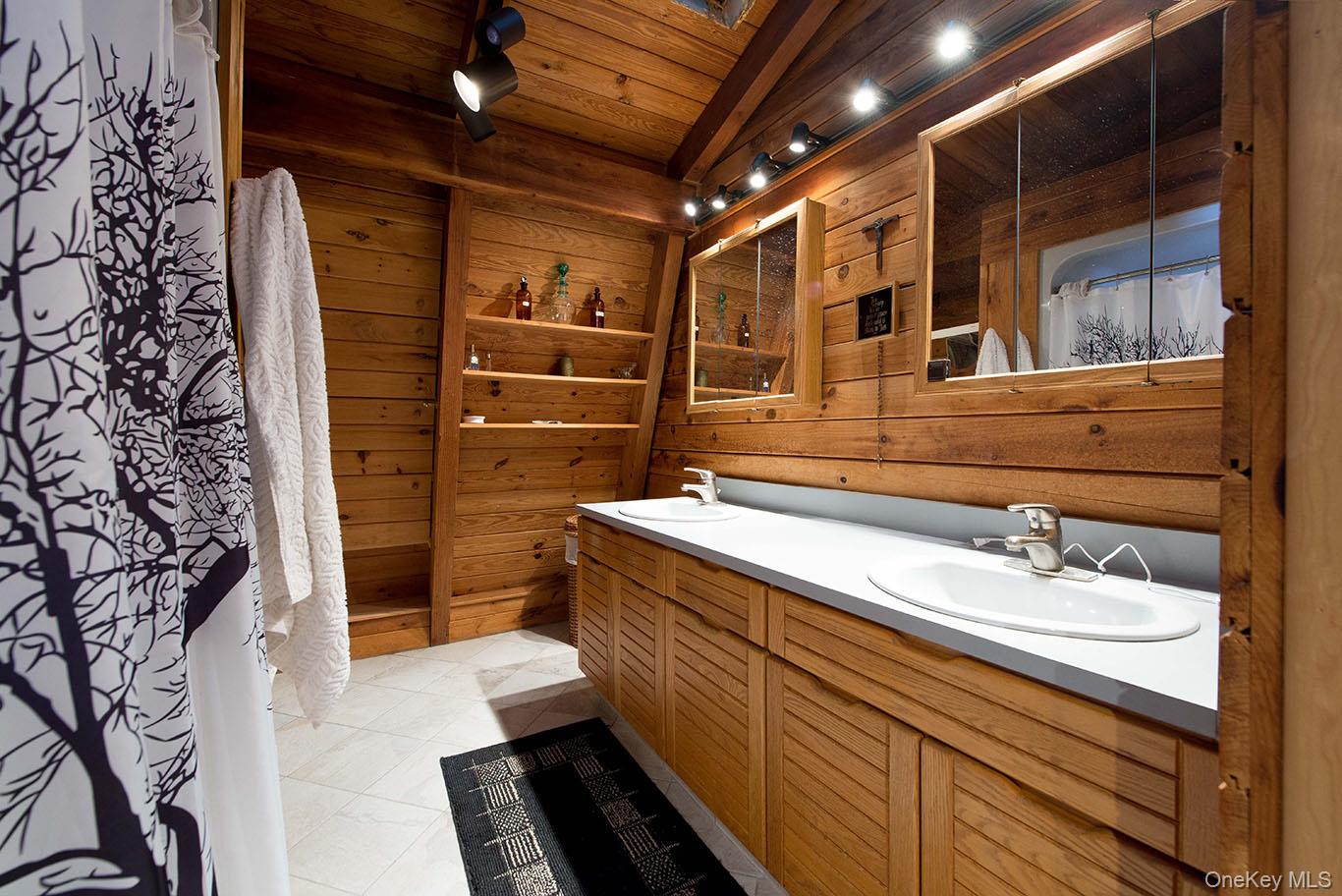 1644 Lakes Road Monroe, NY 10950 - Photo 22 of 49 a bathroom with a sink and a shower