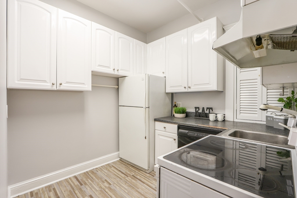 520 Beacon Street, Unit 2F Boston, MA 02215 - Photo 11 of 19 a kitchen with stainless steel appliances granite countertop a sink stove and refrigerator