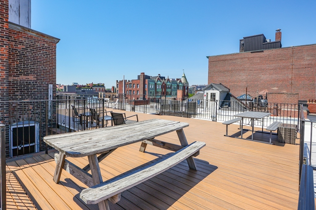520 Beacon Street, Unit 2F Boston, MA 02215 - Photo 12 of 19 a view of a rooftop with chairs and a table