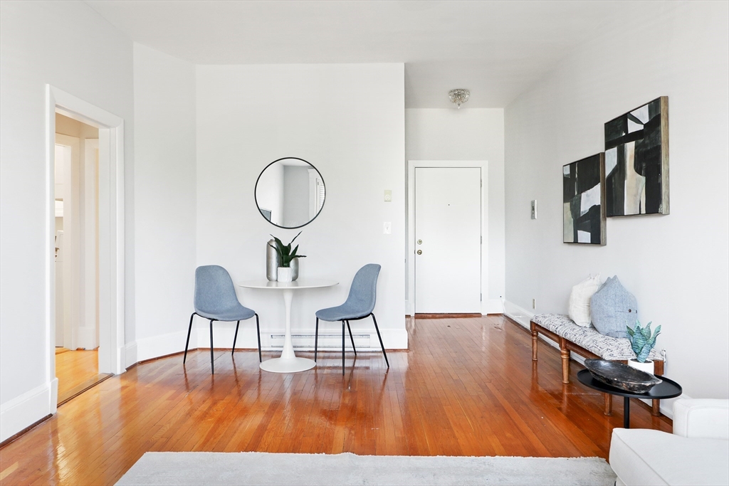 520 Beacon Street, Unit 2F Boston, MA 02215 - Photo 2 of 19 a view of a room with furniture and wooden floor