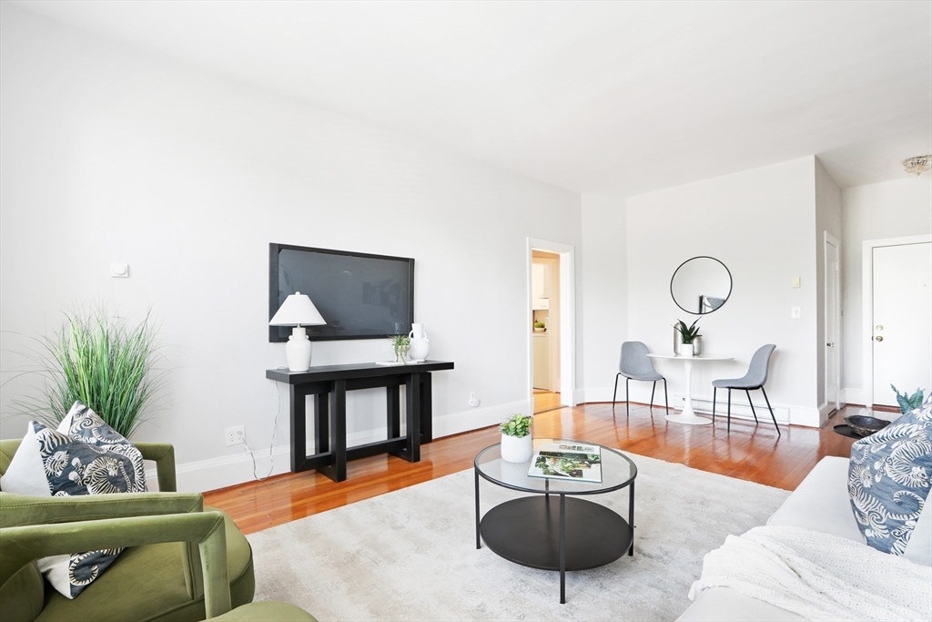 520 Beacon Street, Unit 2F Boston, MA 02215 - Photo 3 of 19 a living room with furniture and wooden floor