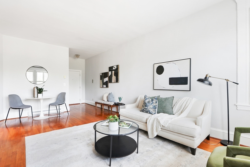 520 Beacon Street, Unit 2F Boston, MA 02215 - Photo 4 of 19 a living room with furniture and wooden floor