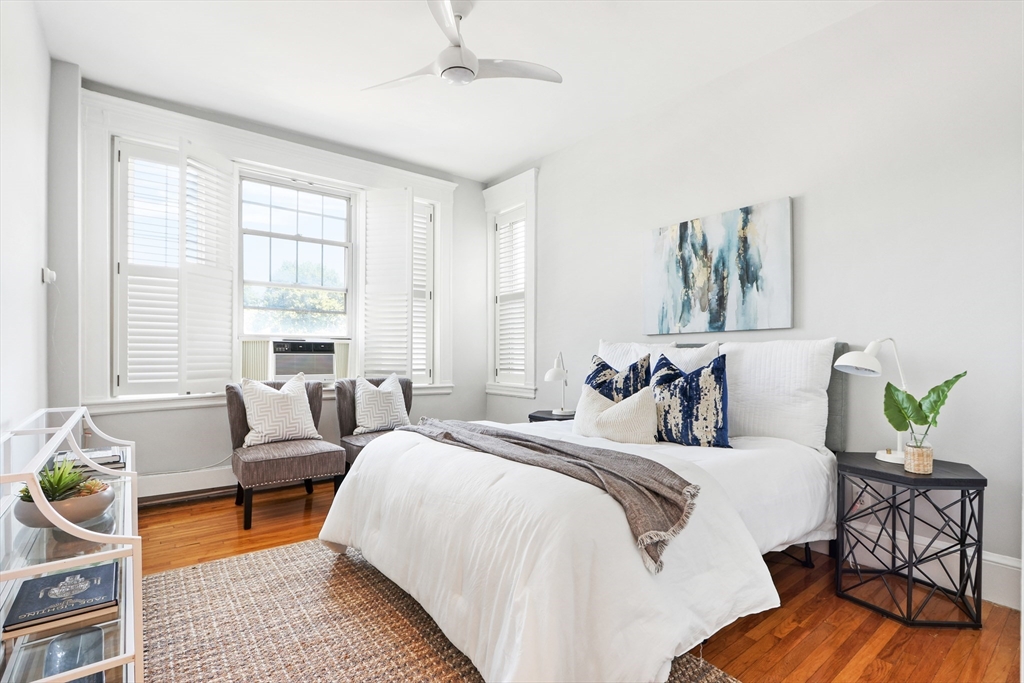 520 Beacon Street, Unit 2F Boston, MA 02215 - Photo 7 of 19 a bedroom with a bed and a couch