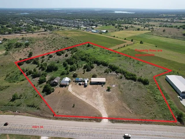 an aerial view of a houses and an outdoor space