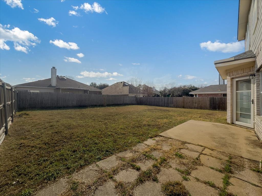 1119 Gaines Mills Road Grand Prairie, TX 75052 - Photo 17 of 29 a front view of a house with a yard