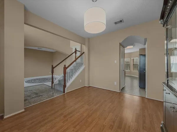 a view of an entryway with wooden floor