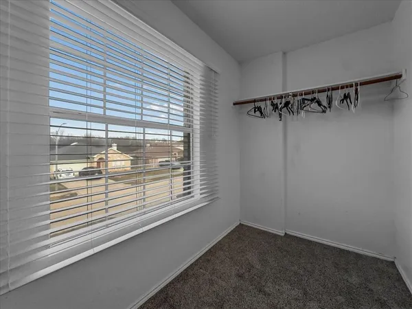 a view of a room that has a window in it