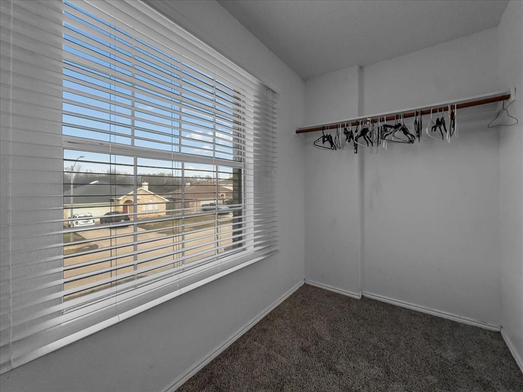 1119 Gaines Mills Road Grand Prairie, TX 75052 - Photo 7 of 29 a view of a room that has a window in it