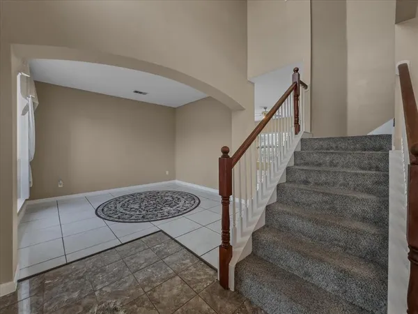 a view of entryway with stairs