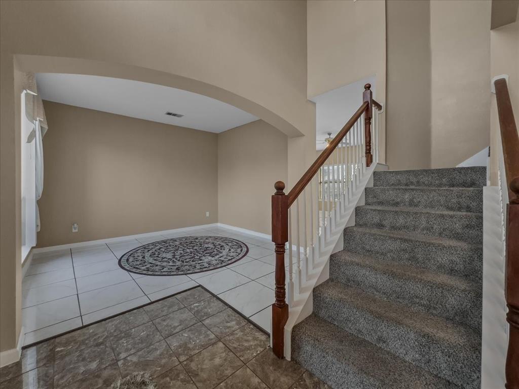 1119 Gaines Mills Road Grand Prairie, TX 75052 - Photo 9 of 29 a view of entryway with stairs