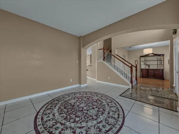 a view of an entryway with a floor to ceiling window