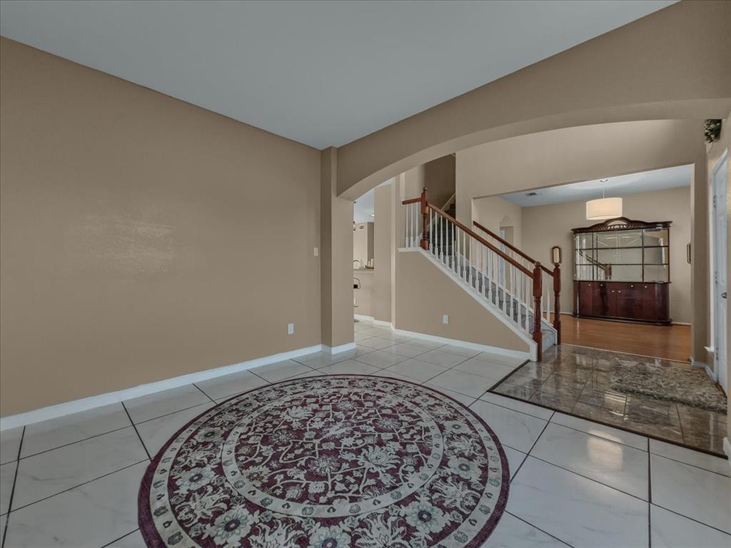 1119 Gaines Mills Road Grand Prairie, TX 75052 - Photo 10 of 29 a view of an entryway with a floor to ceiling window