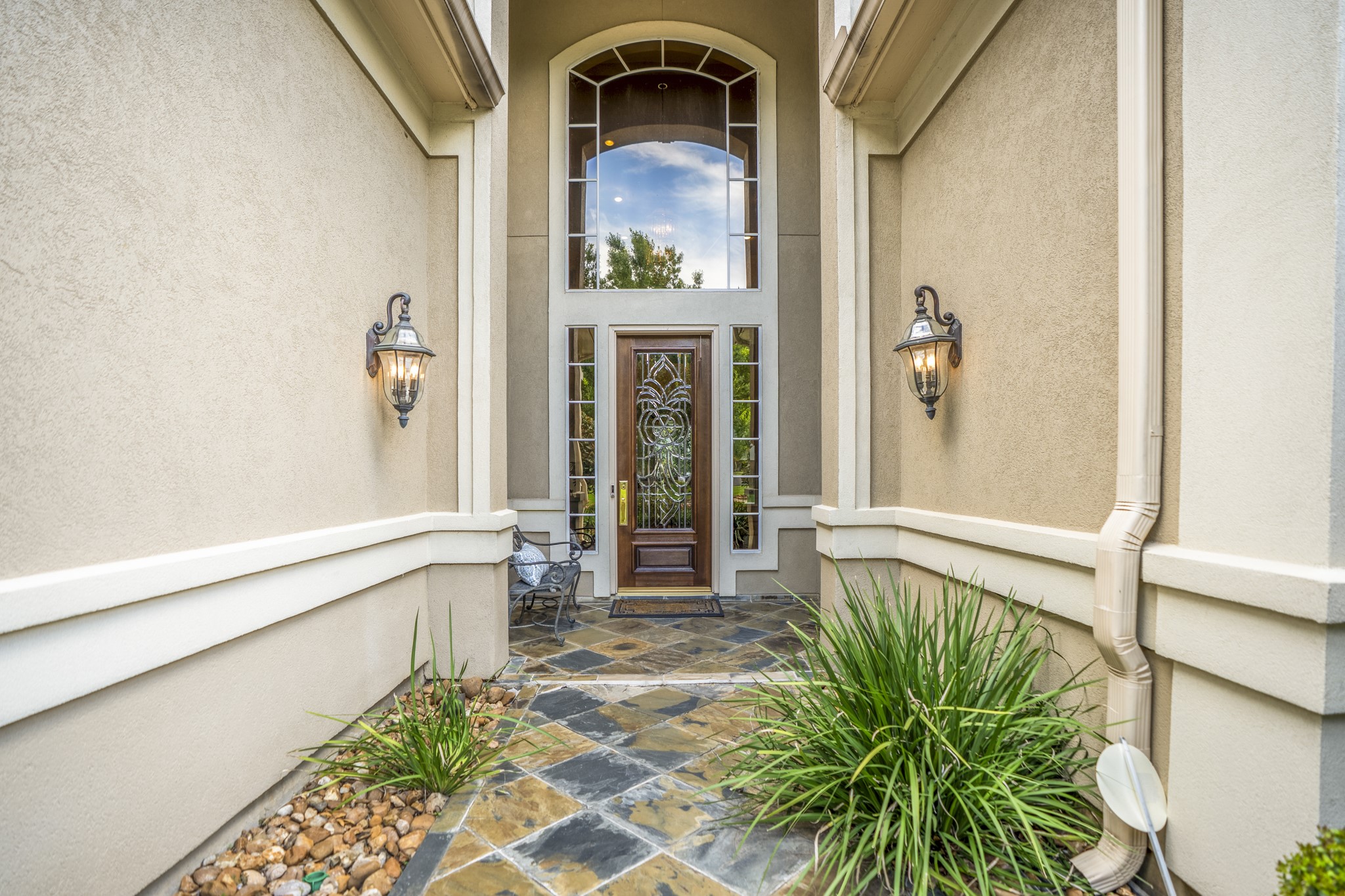 8806 Sterling Gate Circle Spring, TX 77379 - Photo 5 of 40 Slate walk way leading to the front door with solid wood lead glass front door.