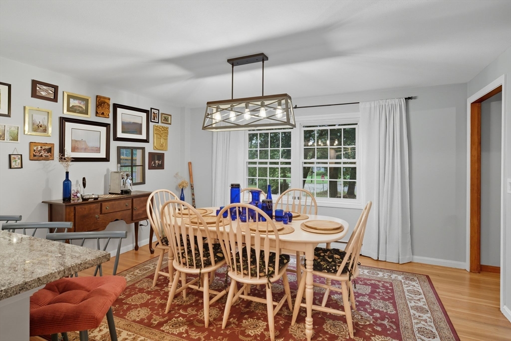 551 West Street Amherst, MA 01002 - Photo 16 of 39 a view of a dining room with furniture window and wooden floor