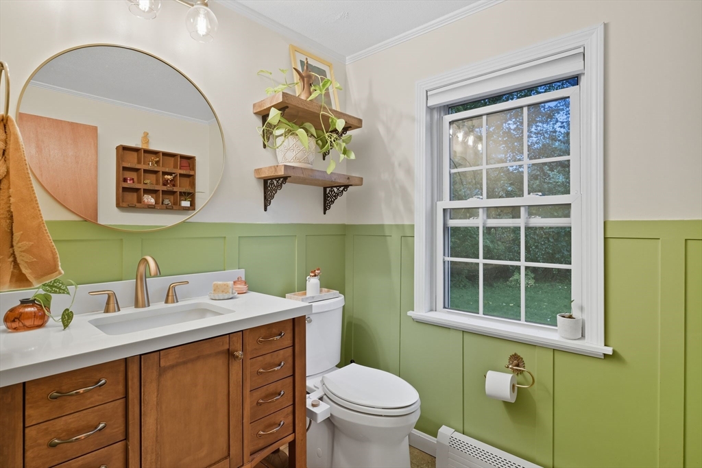 551 West Street Amherst, MA 01002 - Photo 21 of 39 a bathroom with a toilet sink and mirror