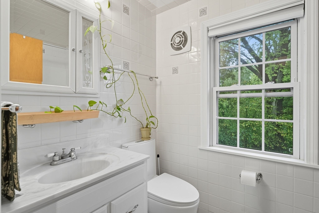 551 West Street Amherst, MA 01002 - Photo 26 of 39 a bathroom with a sink a toilet and a mirror