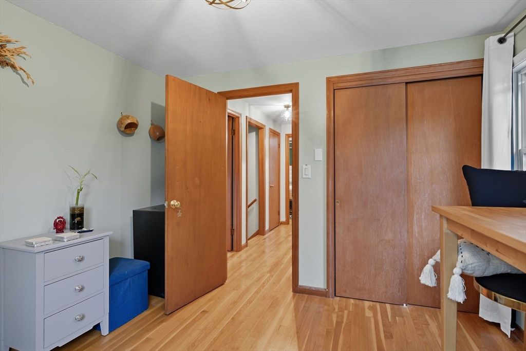 551 West Street Amherst, MA 01002 - Photo 30 of 39 a room with a bed and a flat tv screen on the dresser