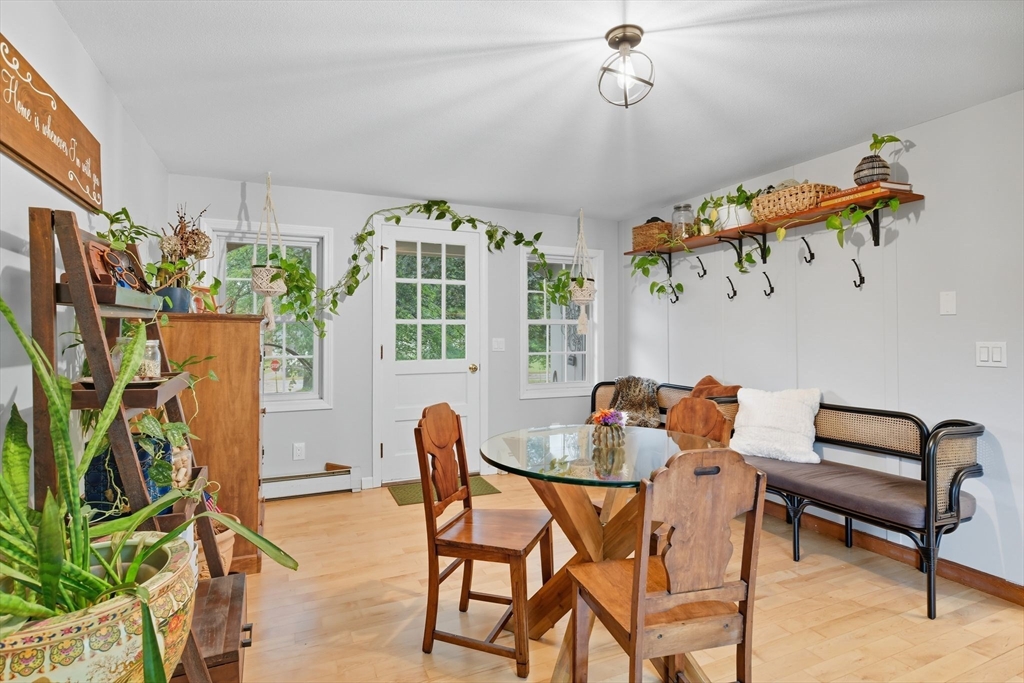 551 West Street Amherst, MA 01002 - Photo 5 of 39 a dining room filled with furniture and a flat screen tv