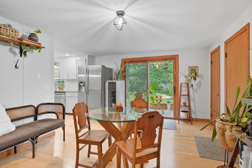 551 West Street Amherst, MA 01002 - Photo 7 of 39 a dining room with furniture garden view and a chandelier