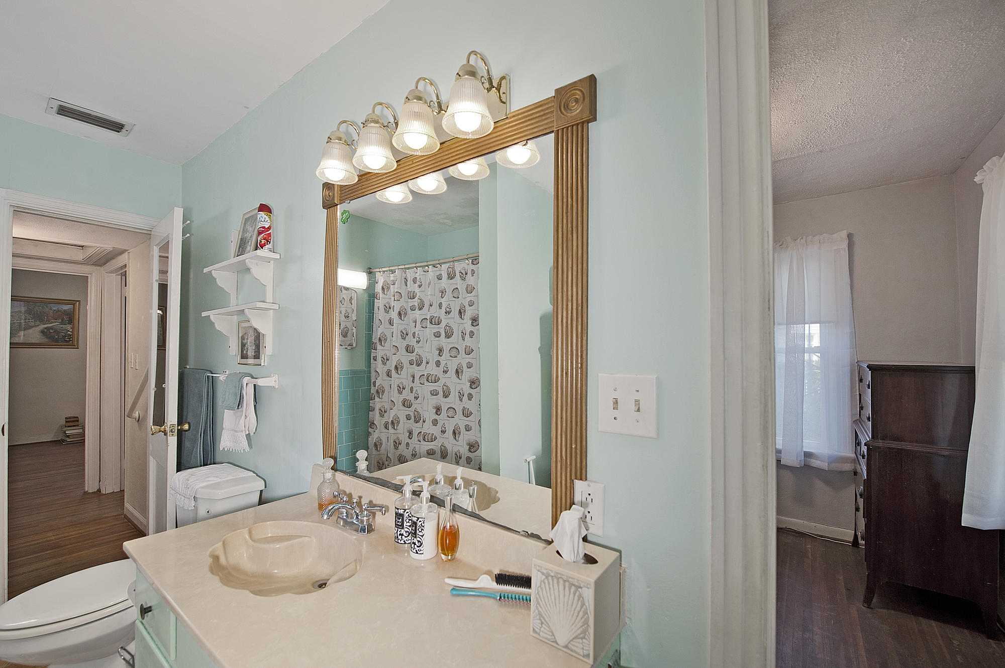 305 Okaloosa Road Northeast Fort Walton Beach, FL 32548 - Photo 12 of 26 a bathroom with a sink vanity mirror and toilet