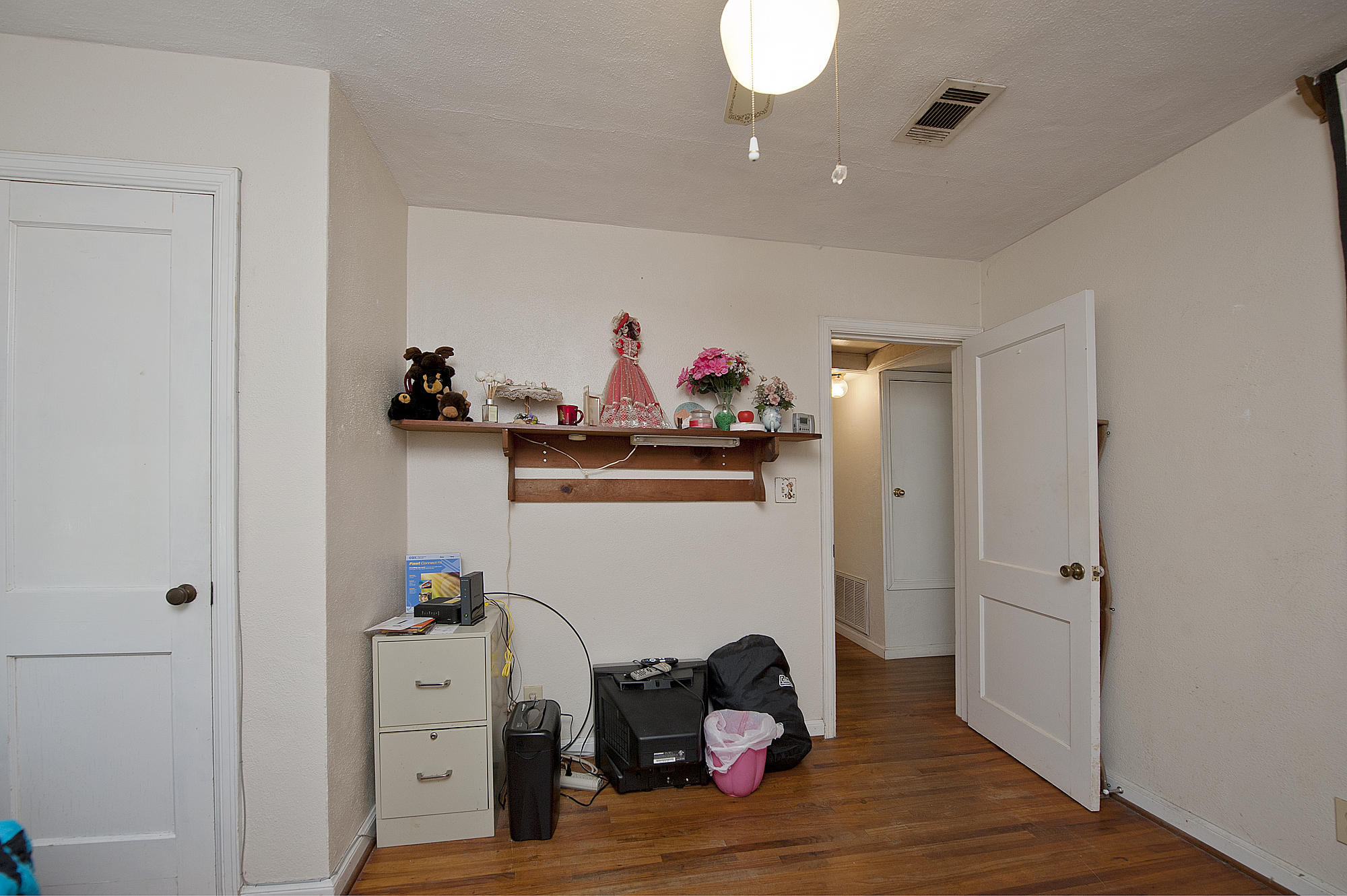 305 Okaloosa Road Northeast Fort Walton Beach, FL 32548 - Photo 16 of 26 a view of a hallway with wooden floor and closet