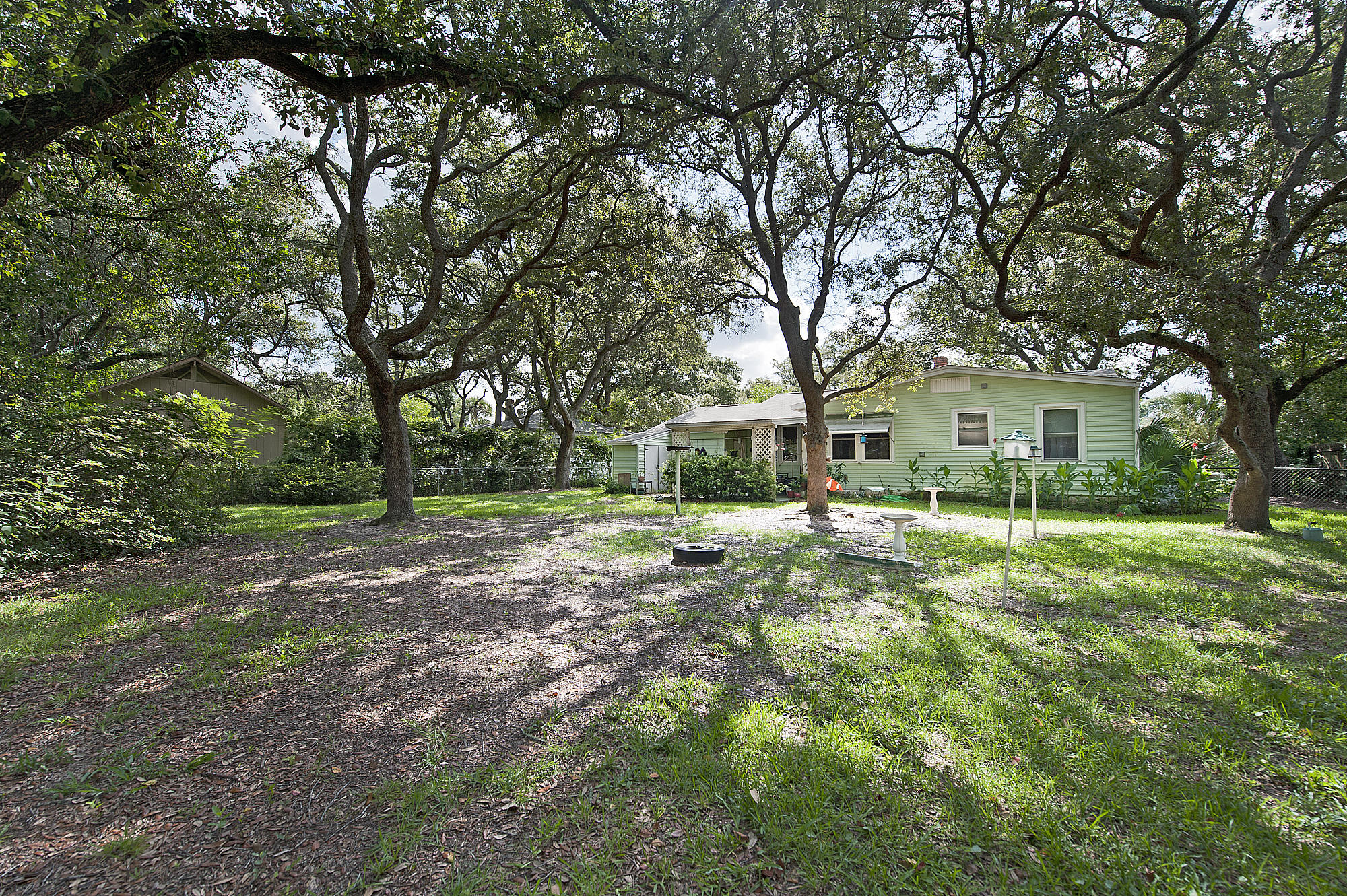 305 Okaloosa Road Northeast Fort Walton Beach, FL 32548 - Photo 22 of 26 a view of a house with a backyard
