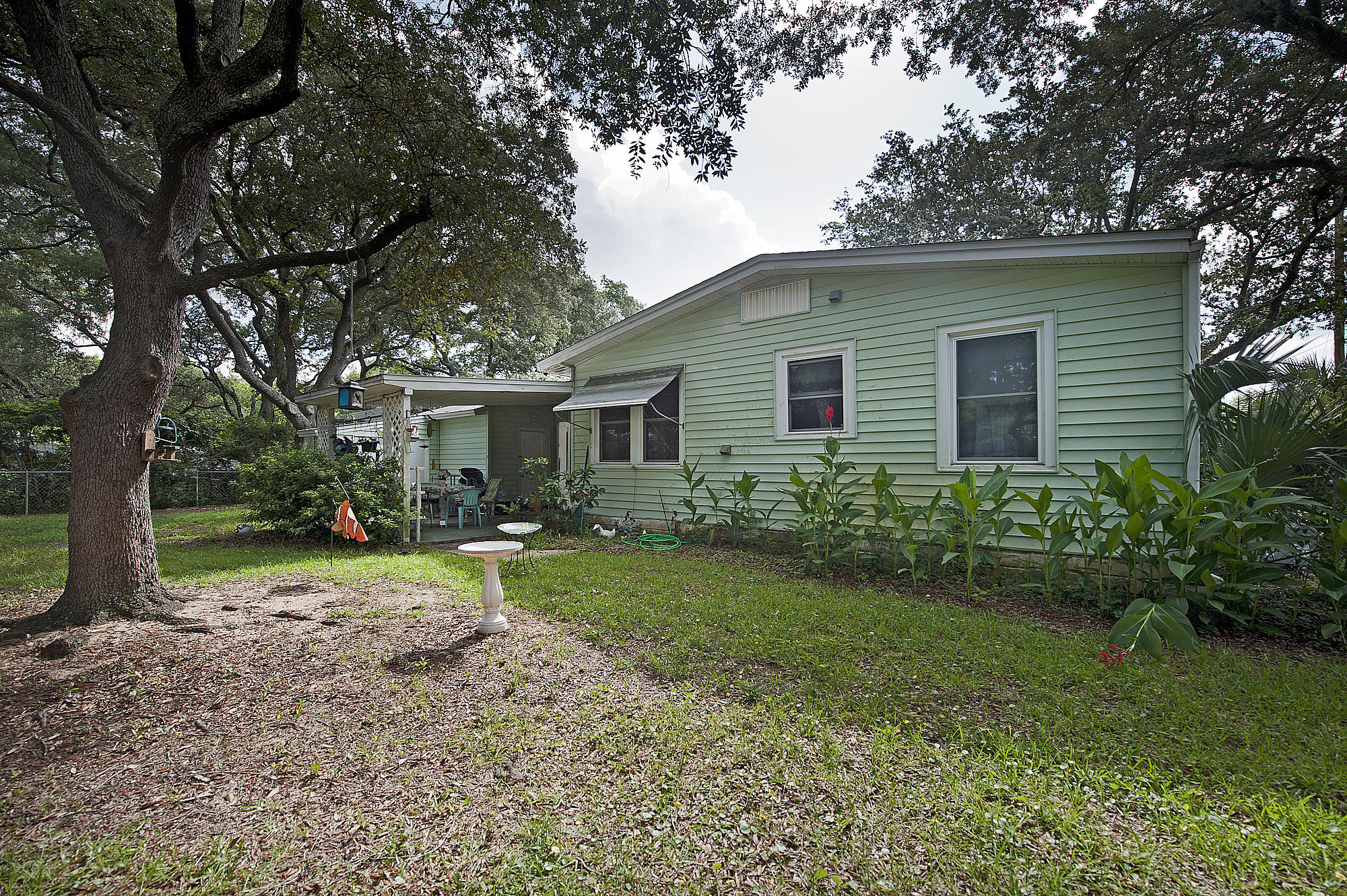 305 Okaloosa Road Northeast Fort Walton Beach, FL 32548 - Photo 23 of 26 a view of a house with yard and a garden