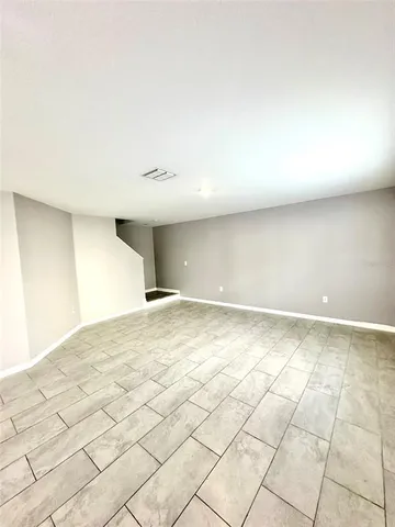 a view of a livingroom with an empty space and a workspace