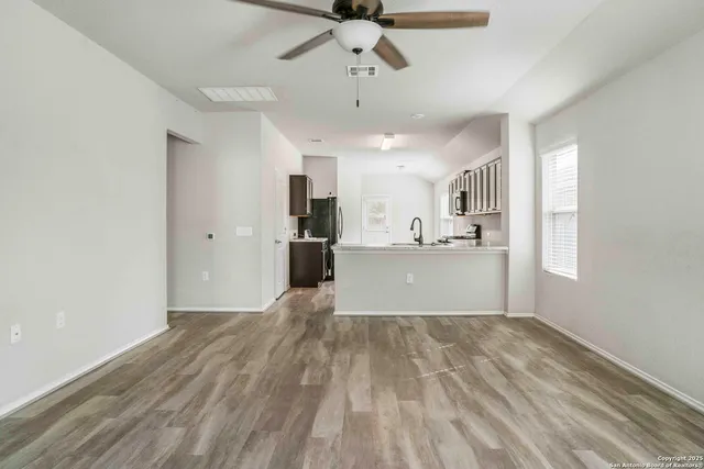 a view of a kitchen with a sink and cabinet area