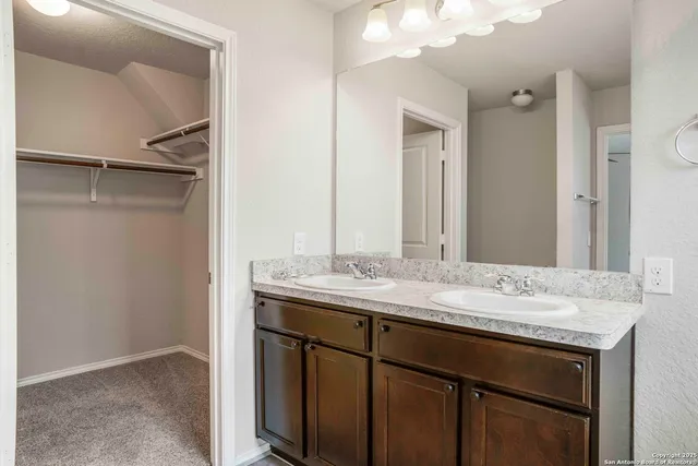 a sink vanity and a mirror