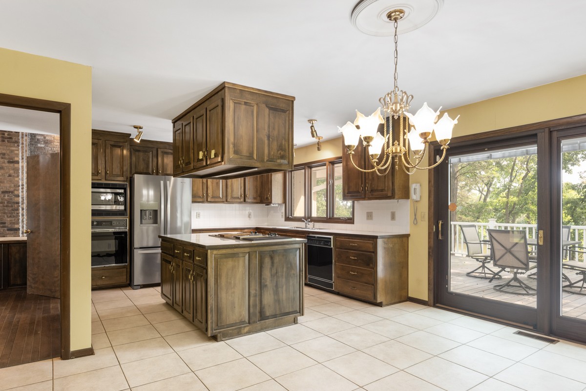 1012 Berwick Trail Madison, TN 37115 - Photo 11 of 35 a kitchen with stainless steel appliances granite countertop a stove and a refrigerator