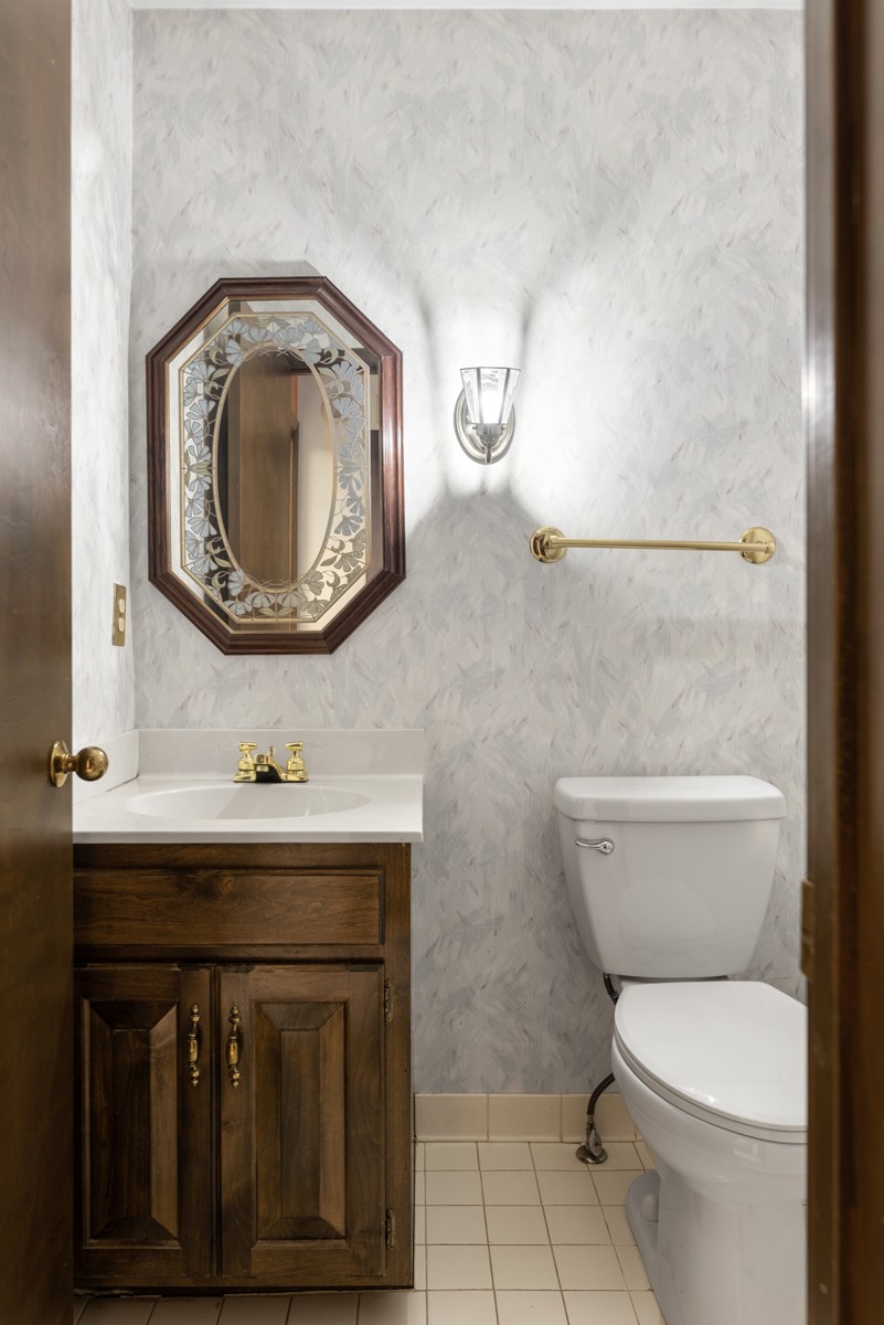 1012 Berwick Trail Madison, TN 37115 - Photo 22 of 35 a bathroom with a toilet a sink and mirror