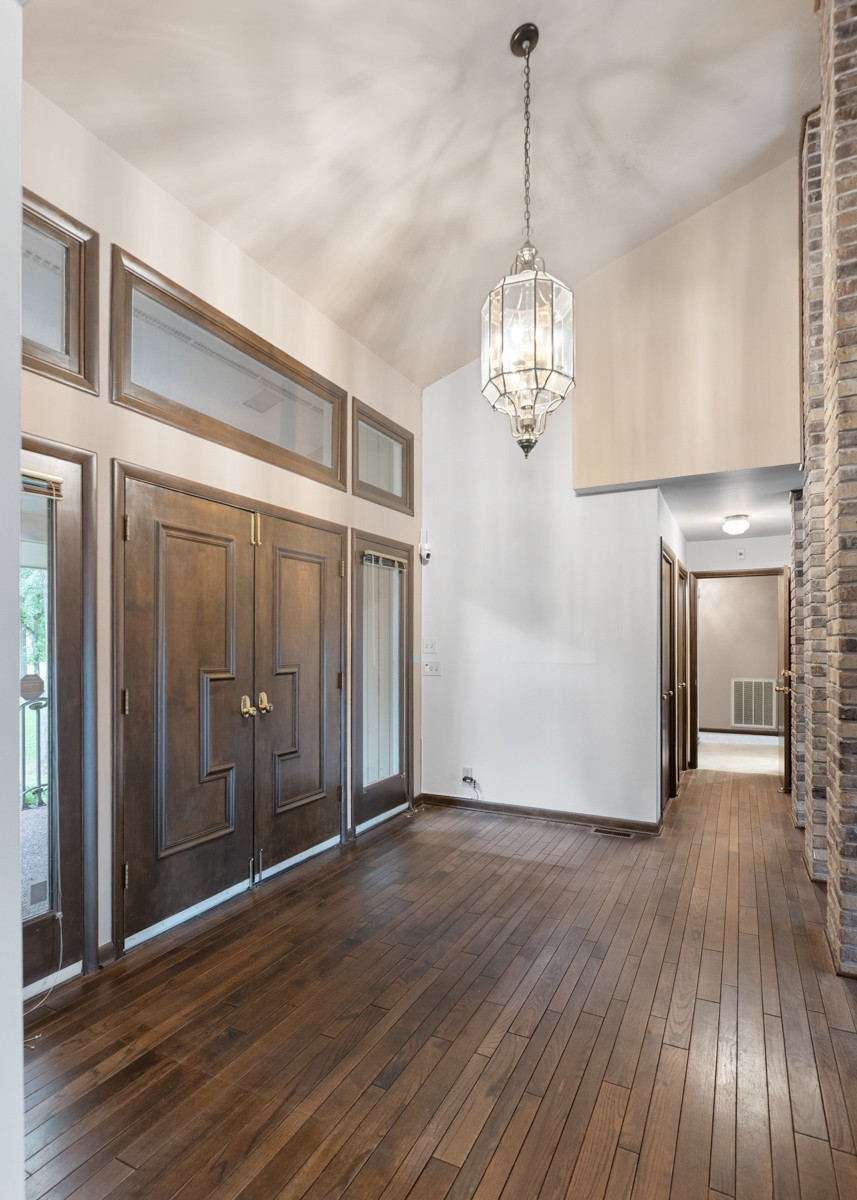 1012 Berwick Trail Madison, TN 37115 - Photo 4 of 35 a view of a hallway with wooden floor and chandelier
