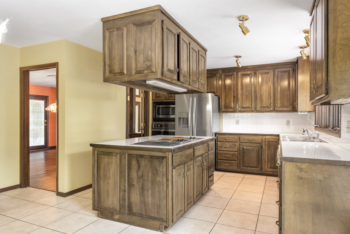 1012 Berwick Trail Madison, TN 37115 - Photo 9 of 35 a kitchen with stainless steel appliances granite countertop a sink and cabinets