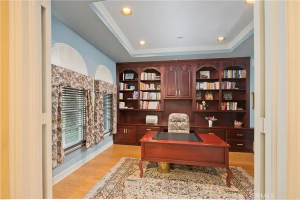 a reading room with furniture and a book shelf