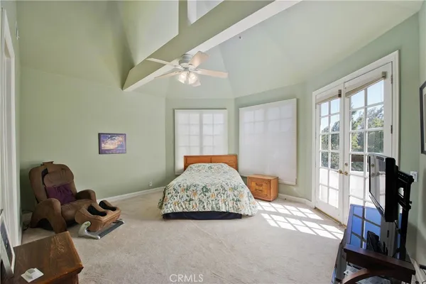 a bedroom with furniture and a window