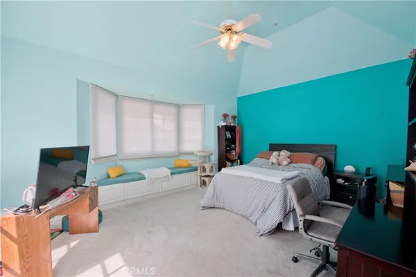 a bedroom with a bed furniture and a window