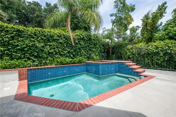 a view of a back yard of a house