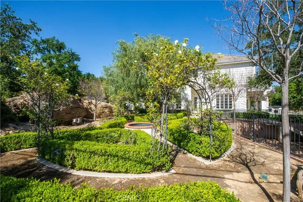 a view of a garden with a fountain