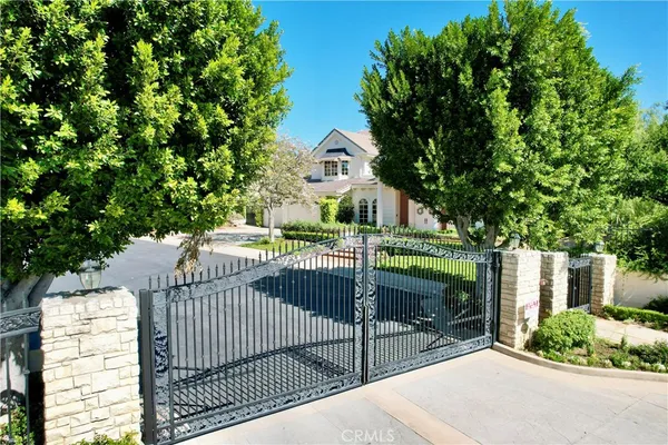 a view of a wrought iron fences in front of house