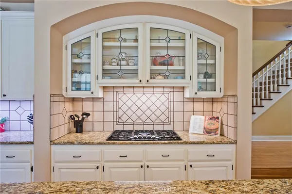 a kitchen with a stove and cabinets