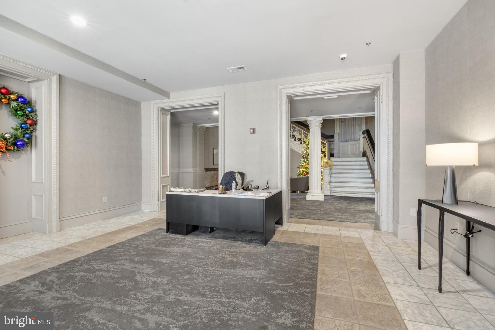 1001 Chestnut Street, Unit 903W Philadelphia, PA 19103 - Photo 11 of 21 a living room with furniture and a window