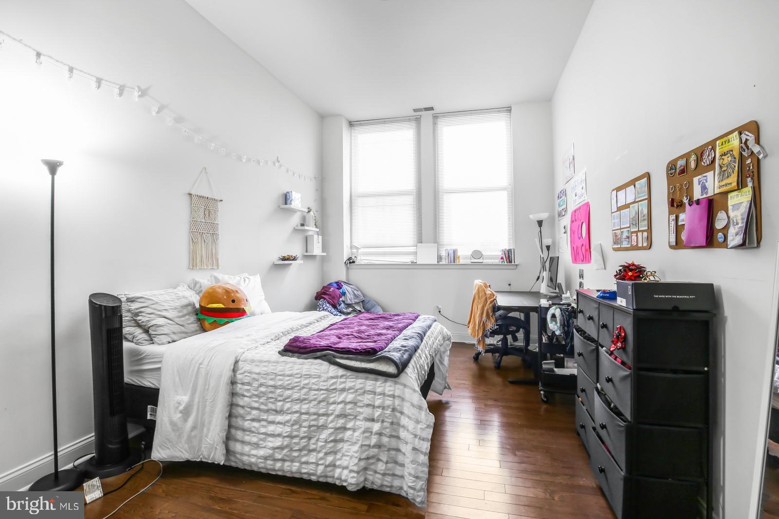 1001 Chestnut Street, Unit 903W Philadelphia, PA 19103 - Photo 8 of 21 a bedroom with furniture and a window